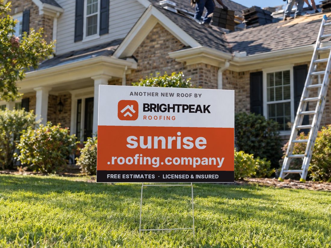 sunrise.roofing.company on a yard sign in front of a house getting a new roof